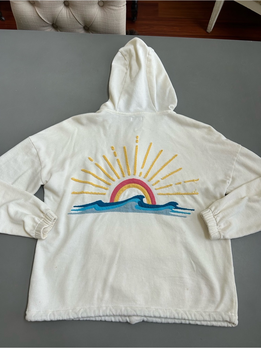 Faherty Cream Hoodie with Yellow Sunburst and Blue Wave Graphic